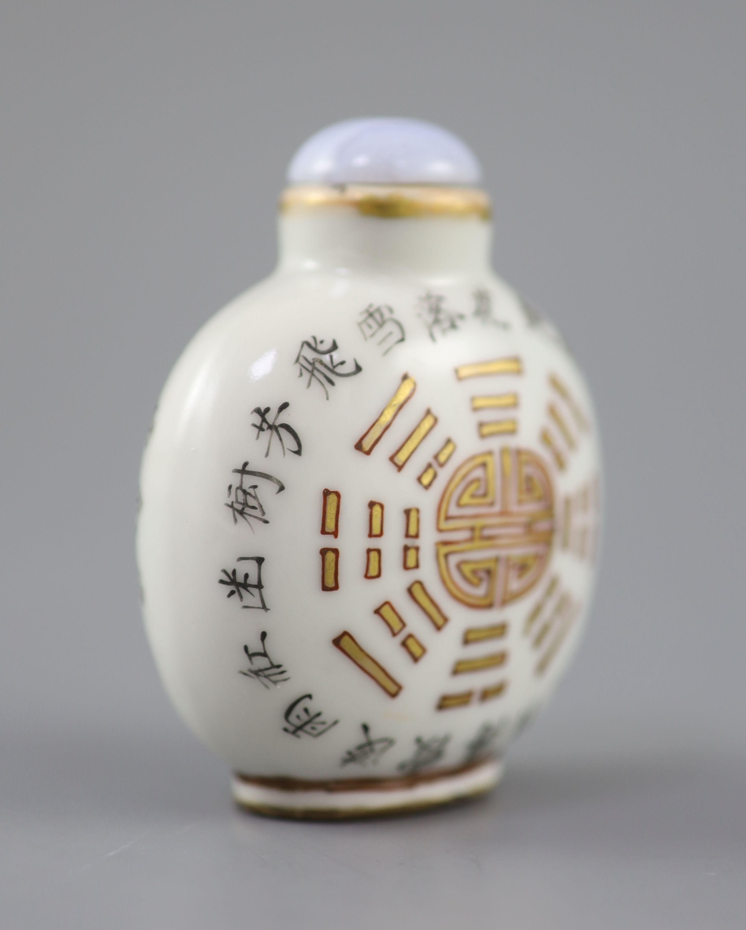 A Chinese iron red and calligraphic porcelain snuff bottle, iron red Daoguang mark and of the period (1821-50), 6.4cm high excluding st